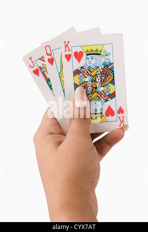 Close-up of a woman's hand holding playing cards Banque D'Images