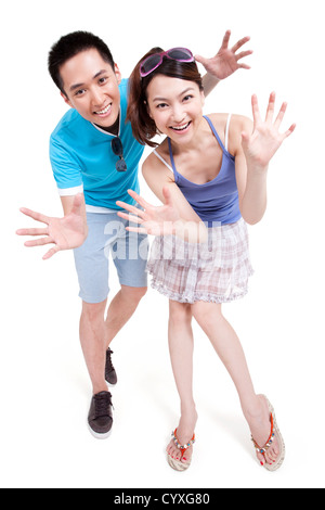 Cheerful young couple gesturing Banque D'Images