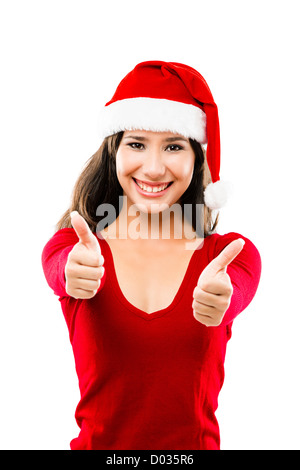 Beautiful Asian woman wearing Santa hat with Thumbs up, isolated on white Banque D'Images