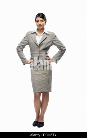 Portrait of a woman standing against a white background Banque D'Images