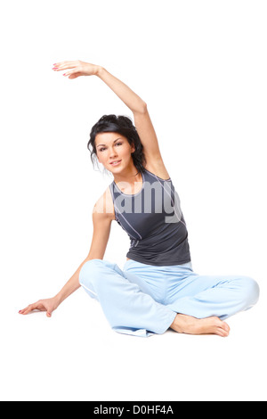 Young woman doing exercise, isolé sur fond blanc Banque D'Images