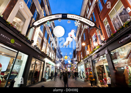 Les lumières de Noël sur l'affichage à Carnaby Street à Londres. Banque D'Images