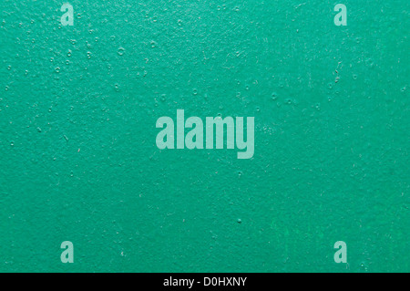 Fond d'écran peint structurels vert sur le mur Banque D'Images