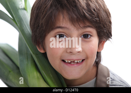 Portrait d'enfant dans les vêtements jardinier Banque D'Images