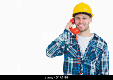 Portrait d'homme à l'aide d'architecte téléphone fixe Banque D'Images