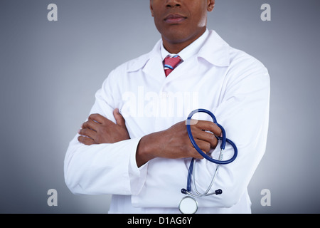 Close-up of confident doctor holding stethoscope Banque D'Images