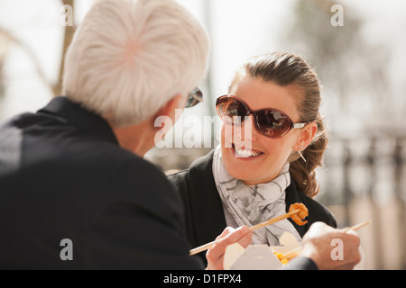 Caucasian business people eating Asian Food Banque D'Images