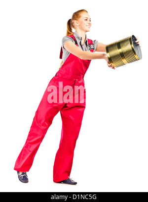 Jeune femme en salopette rouge avec godet, isolated on white Banque D'Images