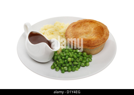 Tarte savoureuse avec de la purée de pommes de terre, petits pois et sauce dans un pot sur une plaque blanche contre isolés Banque D'Images