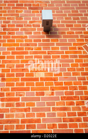 Une image de caméra de sécurité, instaleed sur mur de brique rouge Banque D'Images