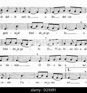 Libre de la musique en feuille avec des notes et des mots pour le chant de Noël traditionnel "Tu scendi dalle stelle" Banque D'Images