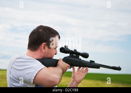 Le but de l'homme, à l'étendue de son fusil Banque D'Images