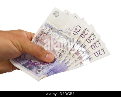 Close-up of a hand holding 100 livres dans 20 notes sur un fond blanc. Banque D'Images