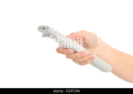 Belle femme part avec une télécommande sur un fond isolé blanc Banque D'Images