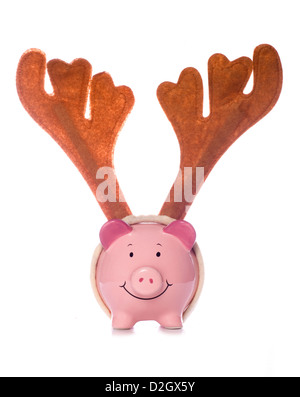 Piggy Bank wearing reindeer antlers noël silhouette studio Banque D'Images