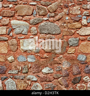 Mur rouge avec des pierres de taille différente - seamless texture Banque D'Images