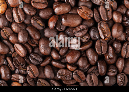 La texture de fond avec des grains de café torréfiés Banque D'Images