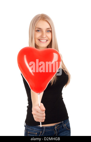 Jeune femme avec ballon en forme de coeur Banque D'Images