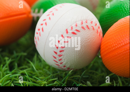 Close-up of assorted balls on grass Banque D'Images