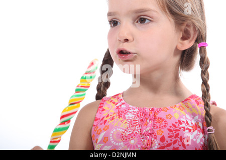 Young Girl eating candy Banque D'Images