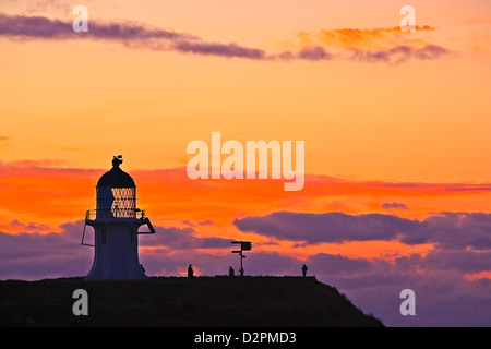 Coucher du soleil à Cape Reinga et phare du cap Reinga, Northland, Nouvelle-Zélande, île du Nord. Banque D'Images