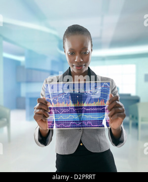 African American businesswoman using digital display Banque D'Images