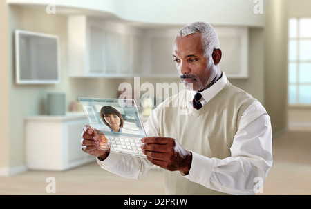 Black businessman using digital tablet in office Banque D'Images