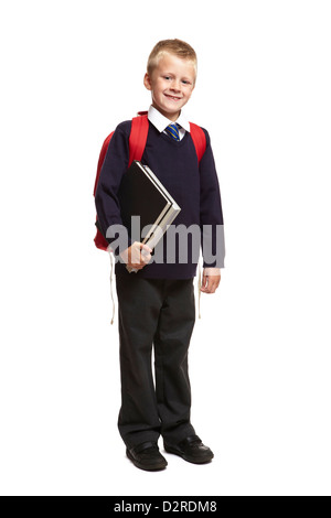 8 ans garçon sac à dos avec la tenue des livres sur fond blanc Banque D'Images