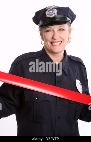 Une femme agent de sécurité avec bande rouge Banque D'Images