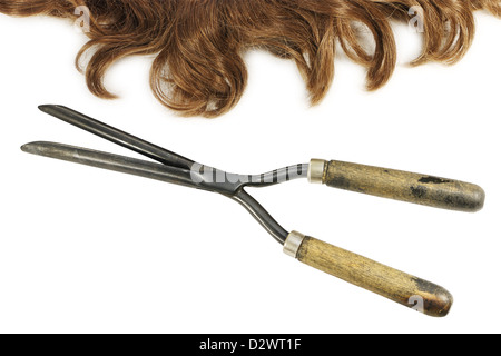 Vintage sex à friser les cheveux ondulés et isolé sur fond blanc Banque D'Images