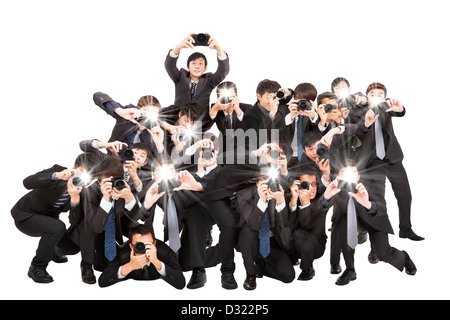 De nombreux photographes holding camera pointant vers vous et isolated on white Banque D'Images