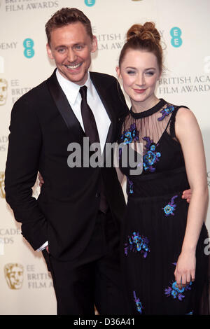 Acteurs Tom Hiddleston et Saoirse Ronan poser dans la salle de presse de l'EE British Academy Film Awards au Royal Opera House de Londres, Angleterre, le 10 février 2013. Photo : Hubert Boesl Banque D'Images