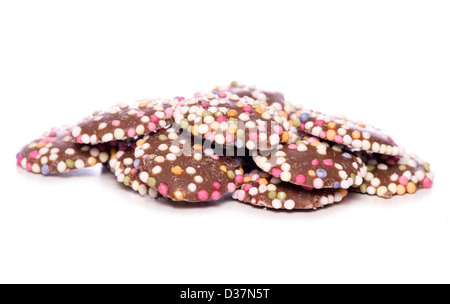 Boutons de chocolat au lait avec découpe studio sprinkles Banque D'Images