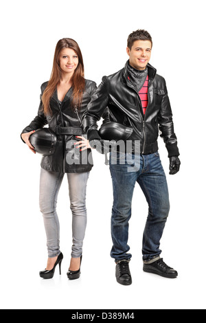 Portrait de deux jeunes motocyclistes dans une veste en cuir posing isolé sur fond blanc Banque D'Images