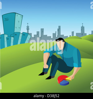 L'homme d'organiser les morceaux d'un camembert dans une pelouse Banque D'Images