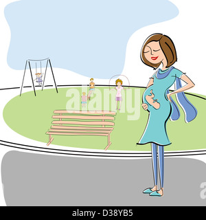 Pregnant woman walking in a park Banque D'Images