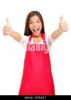 Portrait de l'heureux propriétaire de petite entreprise en tablier rouge showing Thumbs up signe succès isolé sur fond blanc Banque D'Images