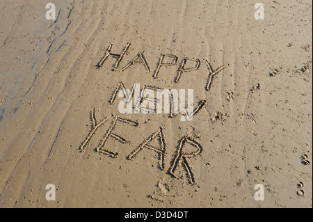 Bonne année message écrit dans le sable à saltburn beach cleveland North Yorkshire UK Banque D'Images