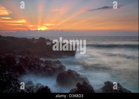 Coucher du soleil avec Dieu du soleil. La Côte Kohala. La Big Island, Hawaii. Banque D'Images