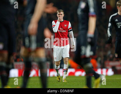 10 févr. 19, 2013 - Londres, Royaume-Uni - l'Arsenal par Mertesacker regarde abattu..v Arsenal - Bayern Munich Ligue des champions deuxième tour, première étape- Emirates Stadium, Londres- 19/02/13 - Photo David Klein/Sportimage Banque D'Images