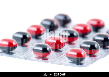 Noir-rouge comprimés sont photographiés un close-up Banque D'Images