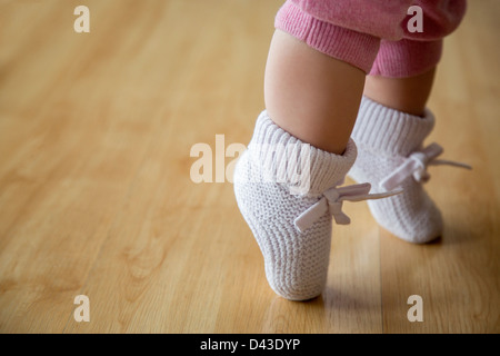 Baby Girl in pink booties Banque D'Images