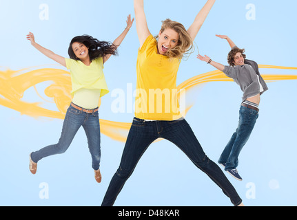 Trois amis heureux sauter de joie Banque D'Images