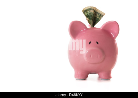 Note Dollar sticking out of piggy bank Banque D'Images