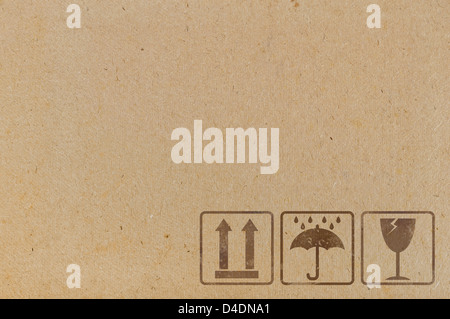 Arrière-plan de carton avec des icônes utilisées sur les contenants et emballages Banque D'Images