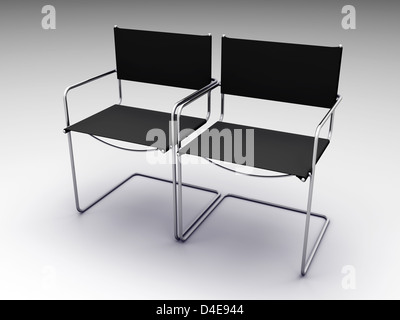 Deux chaises noires sur fond gris Banque D'Images