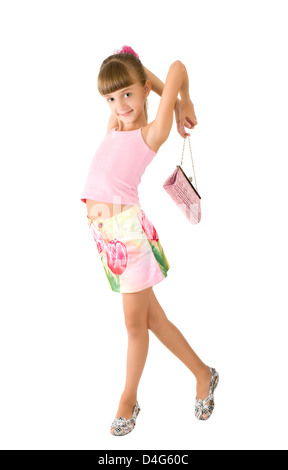 La jeune fille avec un sac à main rose est photographié sur le fond blanc Banque D'Images