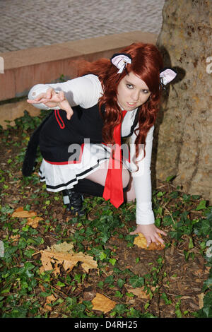 Cosplayeur pose à la Foire du livre à Francfort-sur-Main, Allemagne, 17 octobre 2009. Les cosplayeurs sont de grands fans de bandes dessinées et des dessins animés japonais et d'essayer d'imiter leurs héros de manga et animé par s'habiller comme eux-mêmes en costumes. Les cosplayeurs se réunissent régulièrement au soi-disant conventions, au Japon, manga festivals, Salon du livre et de photos. La plupart d'entre eux Banque D'Images