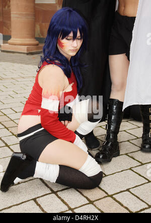 Cosplayeur pose à la Foire du livre à Francfort-sur-Main, Allemagne, 18 octobre 2009. Les cosplayeurs sont de grands fans de bandes dessinées et des dessins animés japonais et d'essayer d'imiter leurs héros de manga et animé par s'habiller comme eux-mêmes en costumes. Les cosplayeurs se réunissent régulièrement au soi-disant conventions, au Japon, manga festivals, Salon du livre et de photos. La plupart d'entre eux Banque D'Images