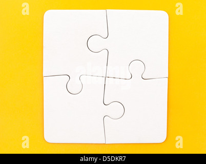 Group de papier blanc Jigsaw puzzles Banque D'Images